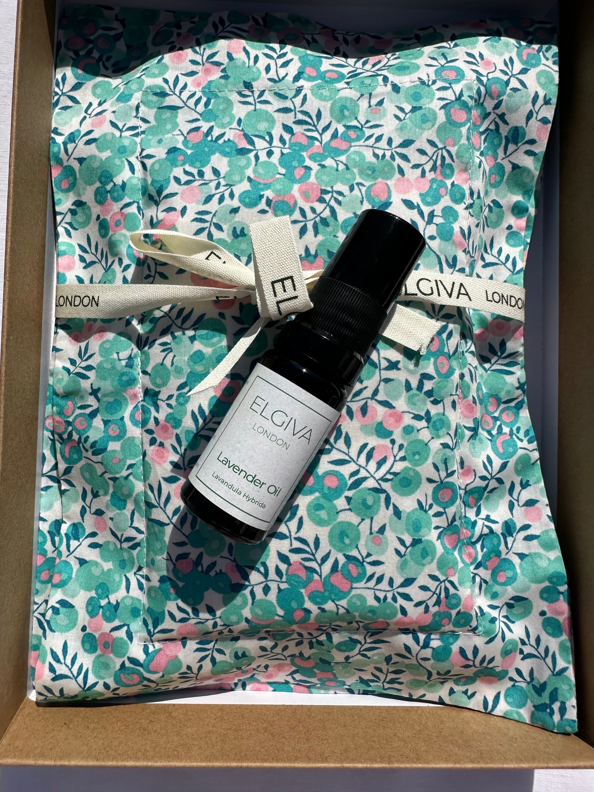 Elgiva boxed lavender sachet in Liberty print fabric, tied with a ribbon with a 10ml bottle of lavender oil