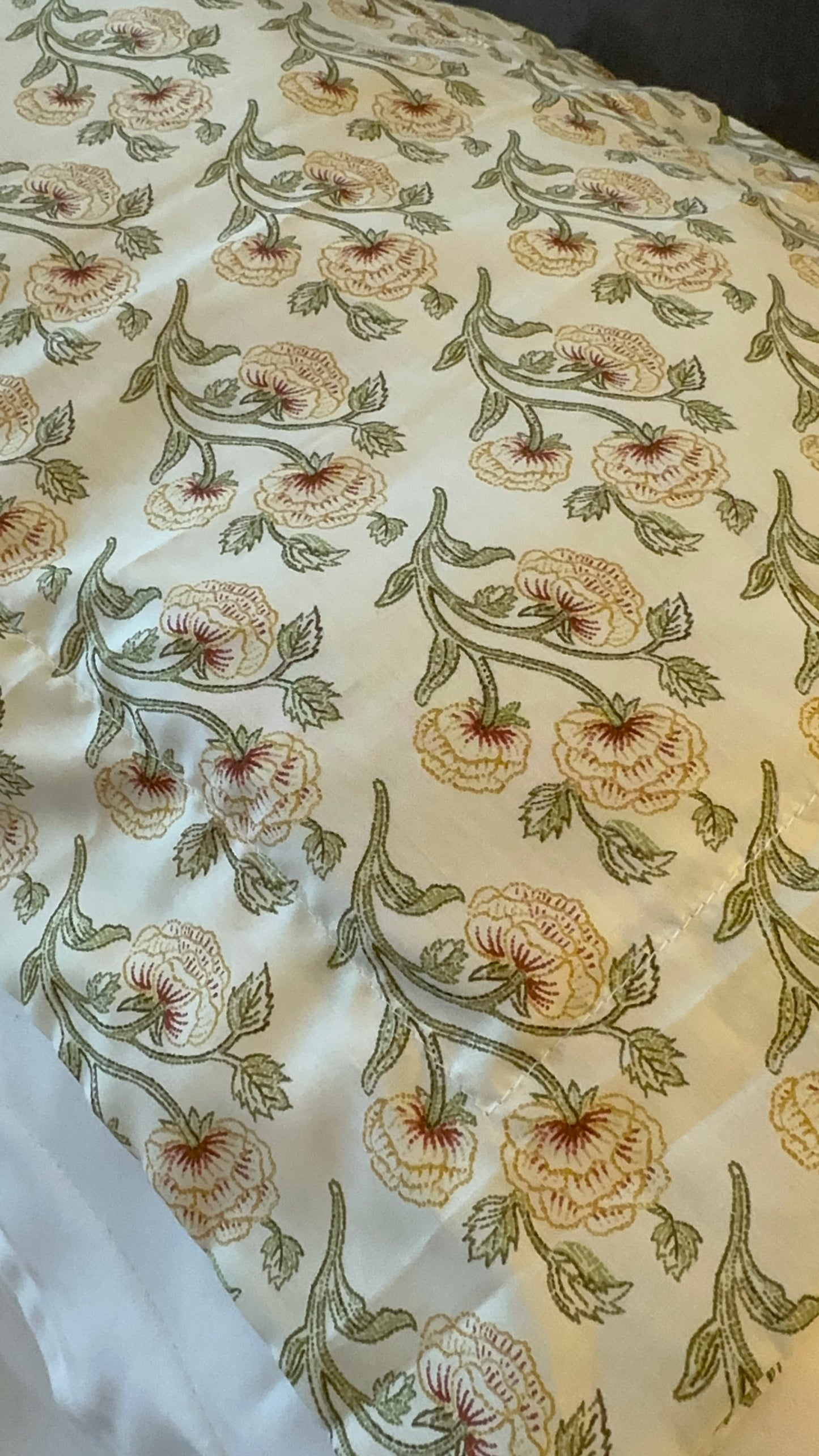 Floral Liberty print Elgiva London lavender sachet on a white pillow