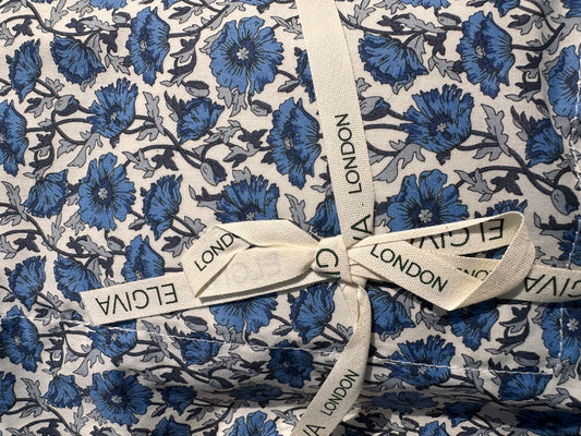 Elgiva London lavender sachet in blue floral liberty print fabric, boxed with an Elgiva ribbon tied around it