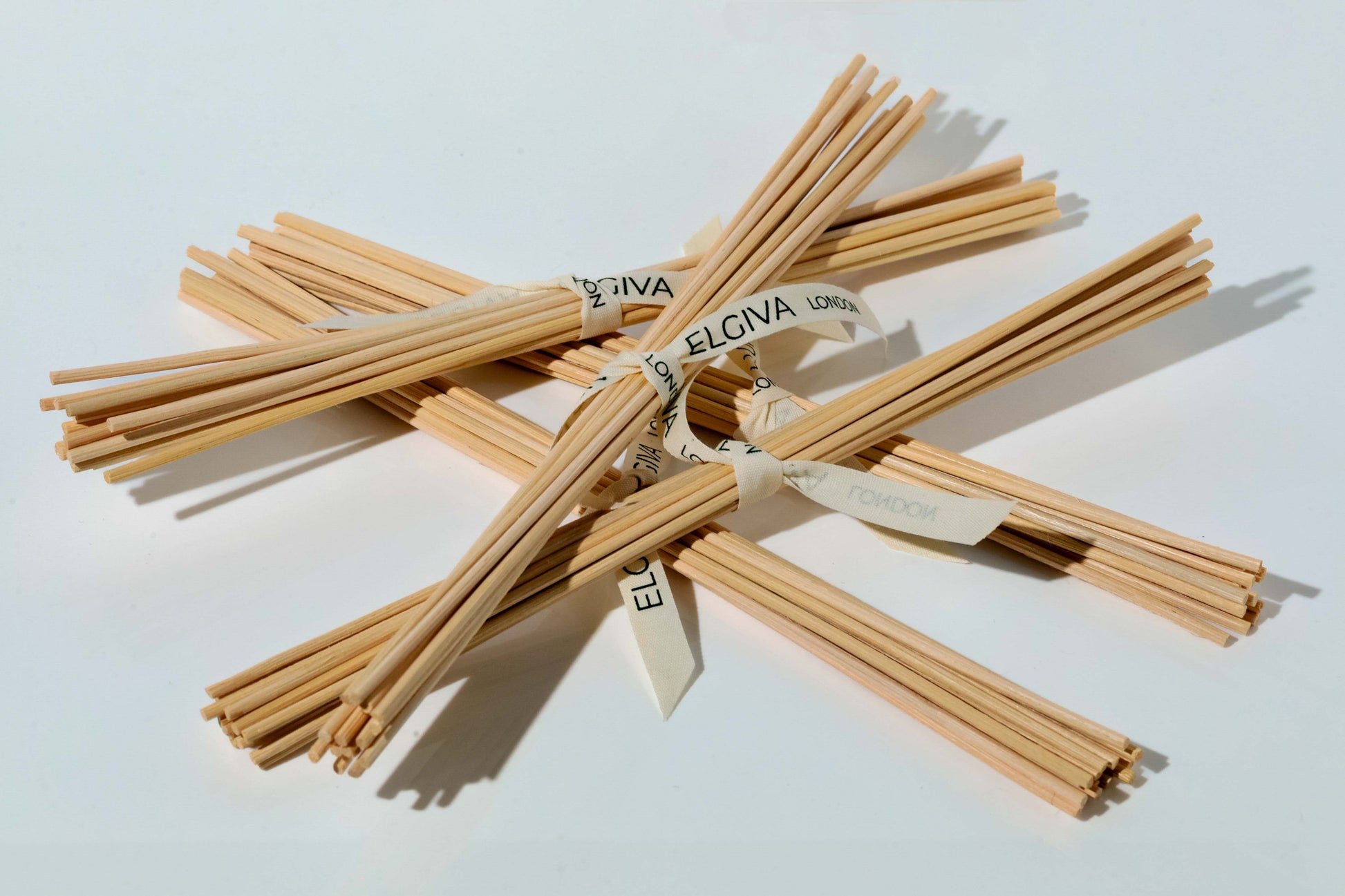 15 reed diffuser sticks tied with Elgiva London branded ribbon